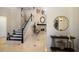 Inviting home foyer showcasing a staircase, fireplace, and stylish decor at 541 Fore Dr, Bradenton, FL 34208