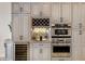 The kitchen features stainless steel appliances, built-in wine rack, and stone countertops at 541 Fore Dr, Bradenton, FL 34208