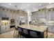 A gourmet kitchen featuring a large center island, stainless steel appliances, and custom cabinetry at 541 Fore Dr, Bradenton, FL 34208