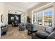 Inviting living room with plantation shutters, comfortable seating, and an arched doorway to the dining area at 541 Fore Dr, Bradenton, FL 34208