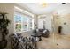 Comfortable living room featuring natural light, tile flooring, and an inviting seating area with neutral tones at 541 Fore Dr, Bradenton, FL 34208