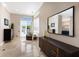 Main bedroom with tiled floors, walk in closet and access to the pool area at 541 Fore Dr, Bradenton, FL 34208
