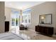 Main bedroom with tiled floors, walk in closet and access to the pool area at 541 Fore Dr, Bradenton, FL 34208
