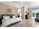 Main bedroom with tiled floors, walk in closet and access to the pool area at 541 Fore Dr, Bradenton, FL 34208