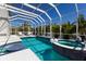 A private, screened-in pool area with a spa and ample space for entertaining at 541 Fore Dr, Bradenton, FL 34208