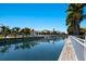 This waterfront view showcases a dock and manicured grounds at 541 Fore Dr, Bradenton, FL 34208