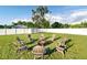 Backyard featuring a fire pit with chairs, perfect for outdoor gatherings at 5524 25Th W St, Bradenton, FL 34207