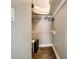 A closet with white walls, a bar for hanging clothes and an elevated shelf for storage at 5524 25Th W St, Bradenton, FL 34207