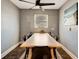 Cozy dining room with modern table, stylish ceiling fan, and natural light from the window at 5524 25Th W St, Bradenton, FL 34207