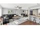 Spacious living area with dark wood floors, comfortable seating, and bright, modern decor at 5524 25Th W St, Bradenton, FL 34207