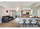 Stylish living room with bar seating that opens to a view of the modern kitchen area at 5524 25Th W St, Bradenton, FL 34207