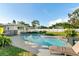Backyard pool with lush landscaping, lounge chairs and white privacy fence at 5524 25Th W St, Bradenton, FL 34207