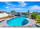 Sparkling pool area surrounded by lush landscaping, perfect for relaxation and enjoying outdoor living at 5524 25Th W St, Bradenton, FL 34207