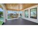 Spacious balcony features water views, outdoor seating, and a wood-look ceiling at 560 Schooner Ln, Longboat Key, FL 34228