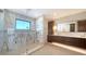 Luxurious bathroom featuring a glass shower, dual sinks, and elegant cabinetry at 560 Schooner Ln, Longboat Key, FL 34228