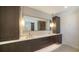 Stylish bathroom featuring dual sinks, modern fixtures, and elegant lighting at 560 Schooner Ln, Longboat Key, FL 34228