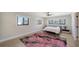 Cozy bedroom featuring a colorful rug, modern furnishings, and natural light at 560 Schooner Ln, Longboat Key, FL 34228