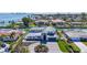 Stunning waterfront home boasting a modern design, circular driveway, and lush landscaping at 560 Schooner Ln, Longboat Key, FL 34228