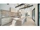 Modern kitchen with a large island, high ceilings, and sleek appliances, offering a bright and airy space at 560 Schooner Ln, Longboat Key, FL 34228