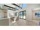 Modern kitchen with a large island, high ceilings, and sleek appliances, offering a bright and airy space at 560 Schooner Ln, Longboat Key, FL 34228