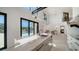 Kitchen featuring a large island, with an open layout connecting seamlessly to a living area and outdoor pool at 560 Schooner Ln, Longboat Key, FL 34228