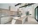 Modern kitchen with a large island, high ceilings, and sleek appliances, offering a bright and airy space at 560 Schooner Ln, Longboat Key, FL 34228