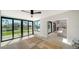 Bright living area with expansive windows offering stunning views, seamlessly blending indoor and outdoor living at 560 Schooner Ln, Longboat Key, FL 34228
