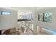 Bright open-concept living space with modern finishes and large windows overlooking the water at 560 Schooner Ln, Longboat Key, FL 34228