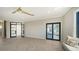 Bright and airy living space with herringbone floors and access to a charming outdoor balcony at 560 Schooner Ln, Longboat Key, FL 34228