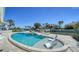 Beautiful pool area with comfortable lounge chairs, jacuzzi and boat dock at 560 Schooner Ln, Longboat Key, FL 34228
