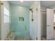 Beautiful bathroom with a glass shower with a bench and accent tile at 611 Dundee Ln, Holmes Beach, FL 34217