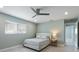 Comfortable bedroom with a ceiling fan and a view of the entryway at 611 Dundee Ln, Holmes Beach, FL 34217