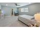 Bright bedroom featuring neutral tones, a ceiling fan, and tile floors at 611 Dundee Ln, Holmes Beach, FL 34217