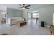 Bright living area with tile floors, modern furniture, and an open floor plan to the kitchen at 611 Dundee Ln, Holmes Beach, FL 34217