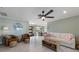 Inviting living room with tile floors, ceiling fan, and comfortable seating for relaxing or entertaining at 611 Dundee Ln, Holmes Beach, FL 34217