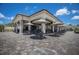 Outdoor bar and lounge area with a shaded pavilion, comfortable seating, and views of the surrounding community at 6115 Cessna Run, Bradenton, FL 34211