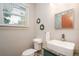 Bright bathroom features modern sink and vanity with decorative wall mirrors at 617 26Th W St, Bradenton, FL 34205