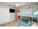 Light filled bunk room with ceiling fan and closet at 617 26Th W St, Bradenton, FL 34205