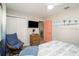 Cozy bedroom featuring a TV, wicker dresser, and colorful wall art at 617 26Th W St, Bradenton, FL 34205