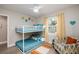 Bright bedroom featuring bunkbeds with modern decor and an accent chair at 617 26Th W St, Bradenton, FL 34205