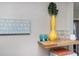 Charming decor featuring a yellow vase and beach themed wall art at 617 26Th W St, Bradenton, FL 34205