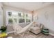 Bright living room with cozy seating, decorative elements and a large window at 617 26Th W St, Bradenton, FL 34205