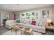 Inviting living room with a comfortable couch, bright light, and stylish decor at 617 26Th W St, Bradenton, FL 34205