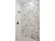 New tile shower features decorative accent tile and a pebble floor at 617 26Th W St, Bradenton, FL 34205