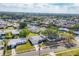 Expansive aerial shot showcases the home's location in a peaceful neighborhood with mature trees at 6637 Bowline Dr, Sarasota, FL 34231