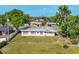 Aerial view of the single-story home, highlighting its large, grassy backyard at 6637 Bowline Dr, Sarasota, FL 34231