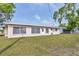 Large backyard with healthy lawn at 6637 Bowline Dr, Sarasota, FL 34231
