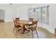 Open dining area with a beautiful table, chairs, and natural light at 6637 Bowline Dr, Sarasota, FL 34231
