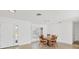 Bright dining area features neutral walls, tile floor, and view to the front yard at 6637 Bowline Dr, Sarasota, FL 34231