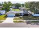 Charming brick home featuring a well-manicured lawn, attached garage, and inviting curb appeal at 6637 Bowline Dr, Sarasota, FL 34231
